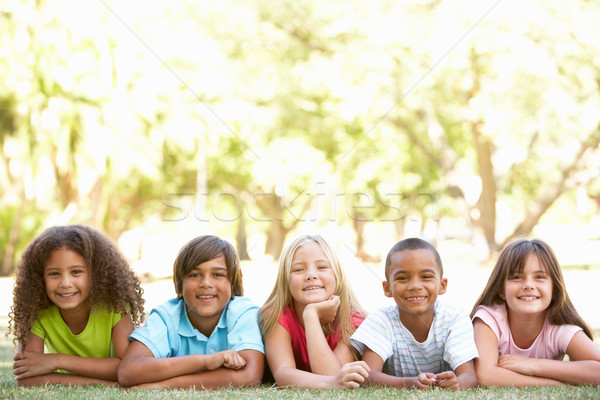 Group Of Children Lying On Stomachs In Park Stock photo © monkey_business