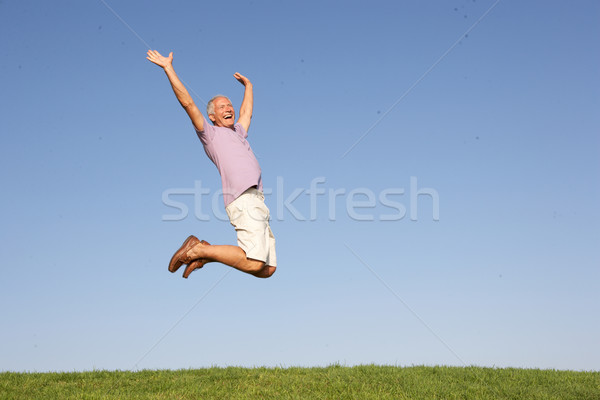 Senior man jumping in air Stock photo © monkey_business