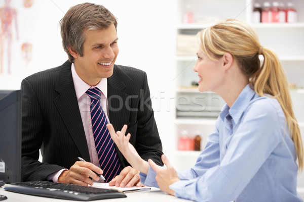 Doctor with female patient Stock photo © monkey_business