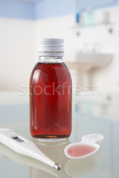 Thermometer and medicine on bathroom shelf Stock photo © monkey_business