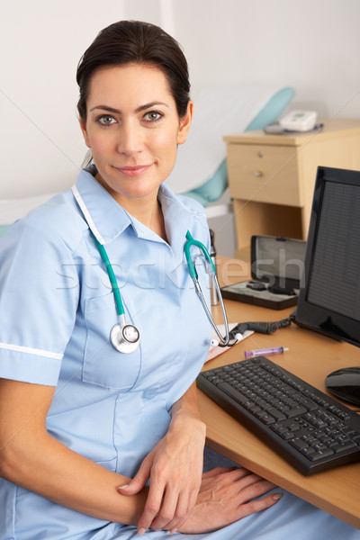 British nurse sitting at desk at work Stock photo © monkey_business