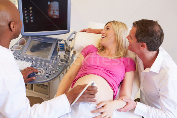 Mulher grávida parceiro ultra-som esquadrinhar mulher médico Foto stock © monkey_business