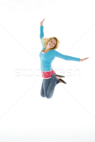 Portret zâmbitor culoare jumping fundal alb Imagine de stoc © monkey_business