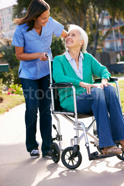 Carer Pushing Senior Woman In Wheelchair Stock photo © monkey_business