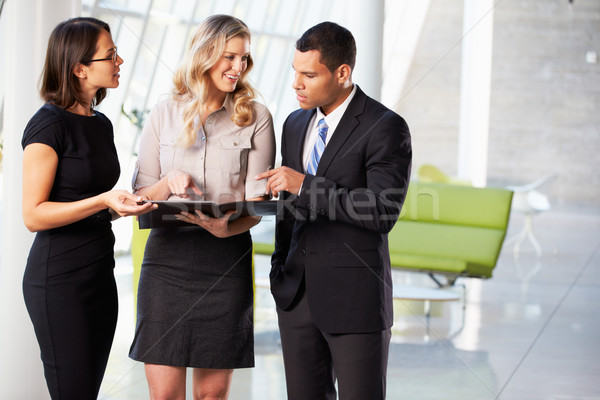 Businesspeople Having Informal Meeting In Modern Office Stock photo © monkey_business