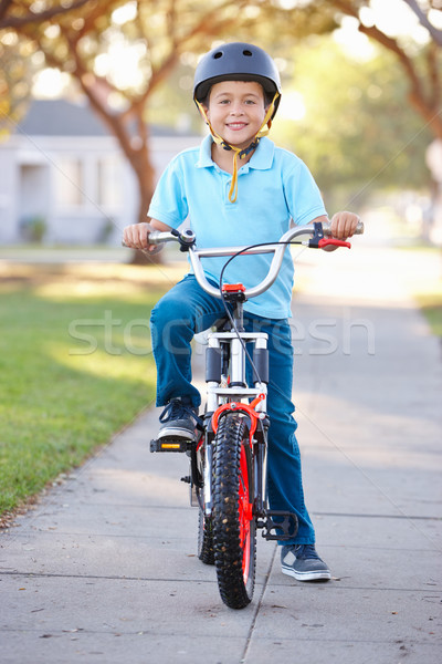 Boy Wearing Safety Helmet Riding Bike Stock photo © monkey_business