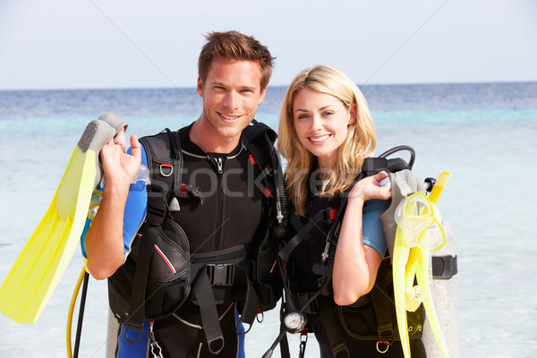 Couple With Scuba Diving Equipment Enjoying Beach Holiday Stock photo © monkey_business