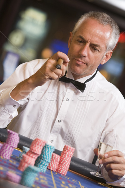 Stock photo: Man gambling at roulette table