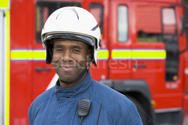Retrato bombeiro em pé carro de bombeiros homem capacete Foto stock © monkey_business
