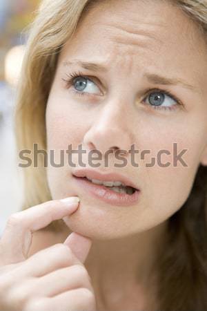 Portrait Of Girl Biting Nails Stock photo © monkey_business