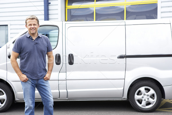 Stock photo: Man standing next to van