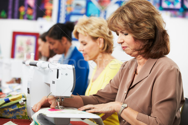 Group Of Women Using Electric Sewing Machines In class Stock photo © monkey_business