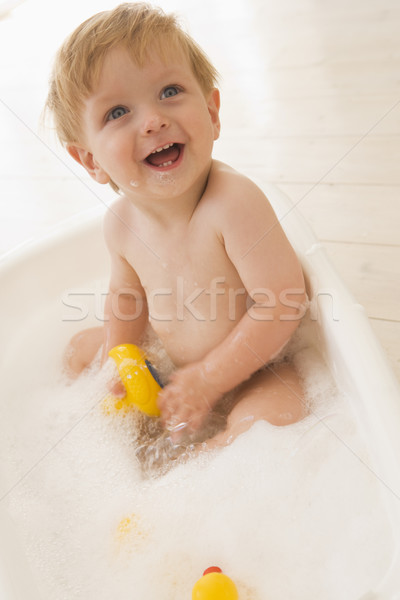 Baba habfürdő fiú fürdőszoba női mosolyog Stock fotó © monkey_business