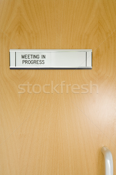 A Closed Office Door, With 'Meeting In Progress' Sign Stock photo © monkey_business