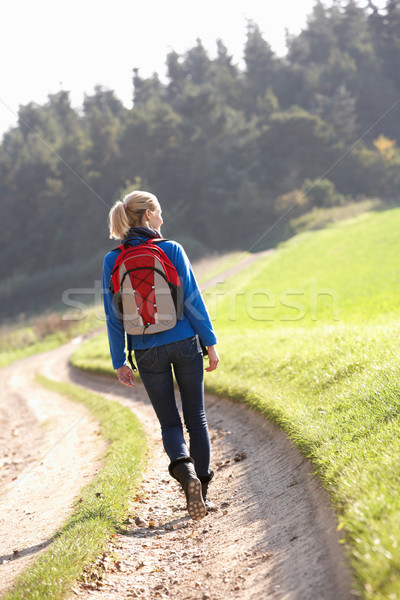 Young woman walks in park Stock photo © monkey_business
