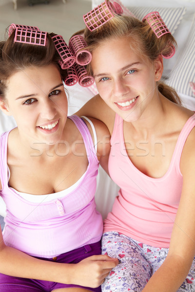 Teenage girls with hair in curlers Stock photo © monkey_business