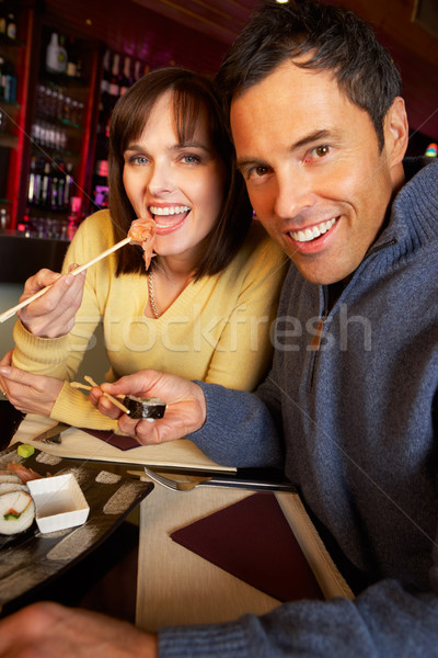 Couple Enjoying Sushi In Restaurant Stock photo © monkey_business