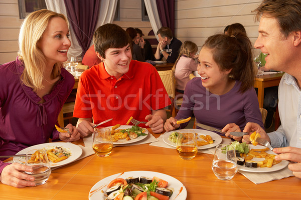 Család eszik ebéd együtt étterem lány Stock fotó © monkey_business