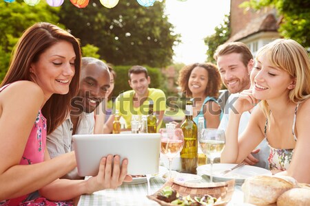 Teenage Girls Sitting Outdoors Eating Fast Food  Stock photo © monkey_business
