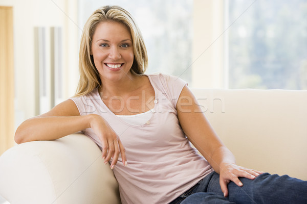 Stock photo: Woman sitting in living room