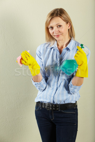 Studio Shot Of Middle Aged Woman Holding Cleaning Products Stock photo © monkey_business