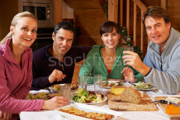 Groep vrienden genieten maaltijd alpine samen Stockfoto © monkey_business