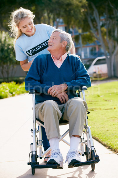 Teenage Volunteer Pushing Senior Man In Wheelchair Stock photo © monkey_business