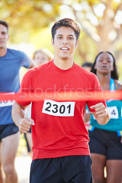 Mannelijke runner winnend marathon vrouw vrouwen Stockfoto © monkey_business