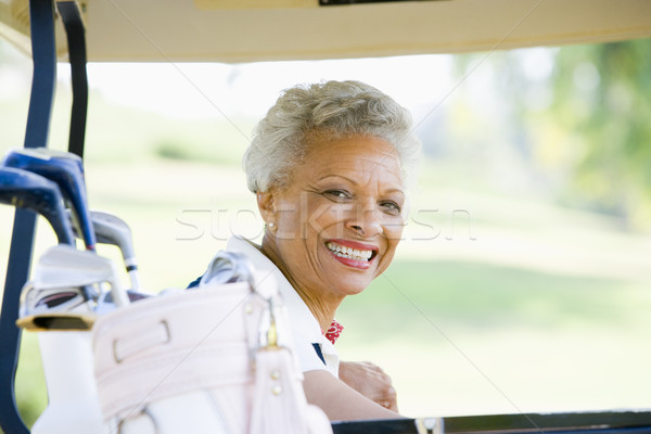 Ritratto donna seduta golf cart sport Foto d'archivio © monkey_business