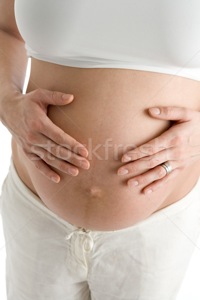 Terhes nő tart védtelen has szeretet boldog Stock fotó © monkey_business