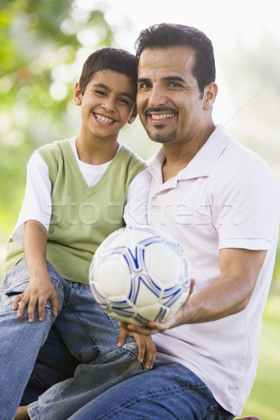 Syn ojca gry piłka nożna wraz parku trawy Zdjęcia stock © monkey_business