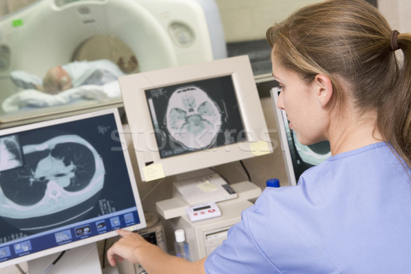 Stock photo: Nurse Monitoring Patient Having A Computerized Axial Tomography 