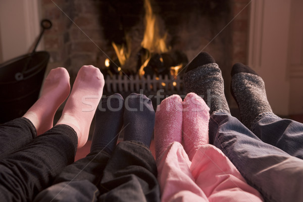 ストックフォト: 家族 · フィート · 暖炉 · 火災 · 男 · 幸せ
