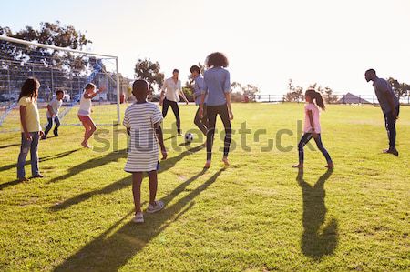 Group Of Teenage Friends Walking Through Autumn Landscape Stock photo © monkey_business