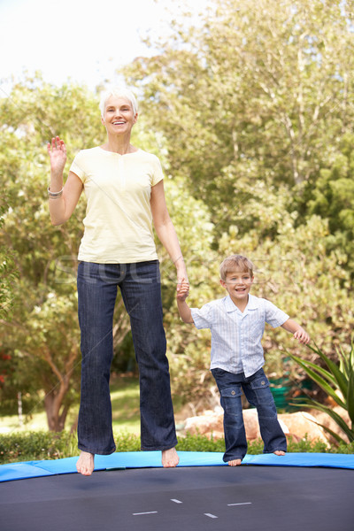 Grandmother And Grandson Jumping On Trampoline In Garden Stock photo © monkey_business