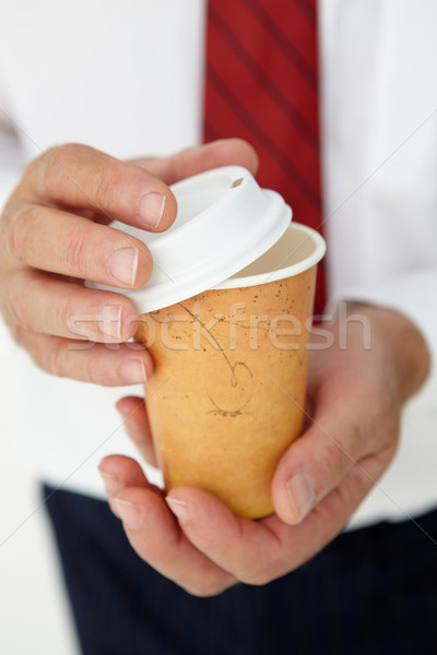 Businessman holding takeout coffee Stock photo © monkey_business