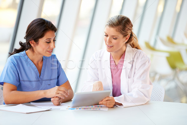 Female Doctor And Nurse Having Meeting In Hospital Canteen Stock photo © monkey_business