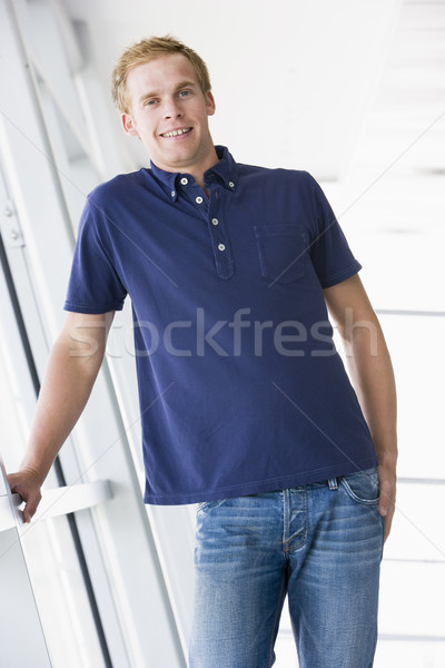 Człowiek stałego korytarz uśmiechnięty biuro szkoły Zdjęcia stock © monkey_business