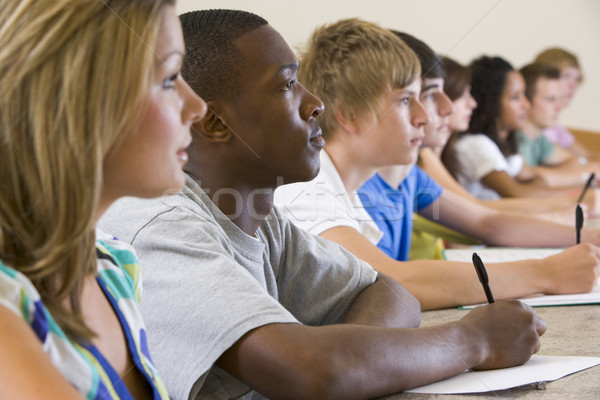 College students listening to a university lecture Stock photo © monkey_business