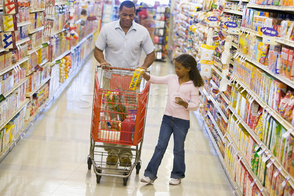 Father and daughter shopping in supermarket Stock photo © monkey_business