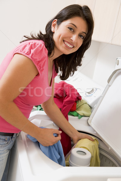 женщину прачечной улыбаясь цвета Постоянный стиральные Сток-фото © monkey_business