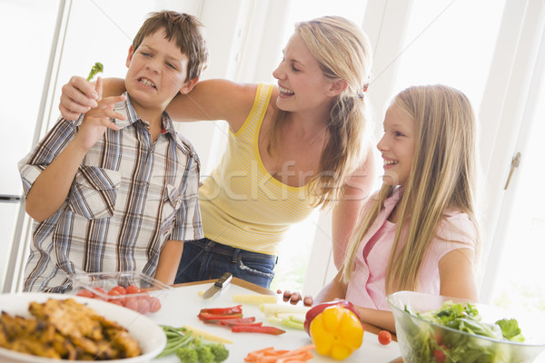 Stock photo: Mother And Children Prepare A meal,mealtime Together 