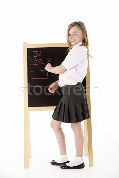 Thoughtful Female Student Wearing Uniform Next To Blackboard Stock photo © monkey_business