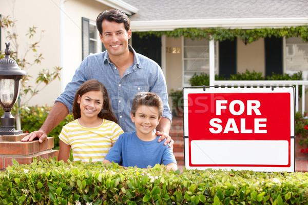 Father and children outside home for sale Stock photo © monkey_business