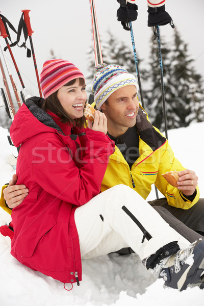 Middle Aged Couple Eating Sandwich On Ski Holiday In Mountains Stock photo © monkey_business
