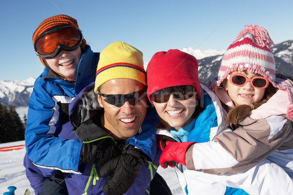Family Having Fun On Ski Holiday In Mountains Stock photo © monkey_business