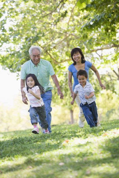 Grands-parents courir petits enfants famille homme heureux [[stock_photo]] © monkey_business