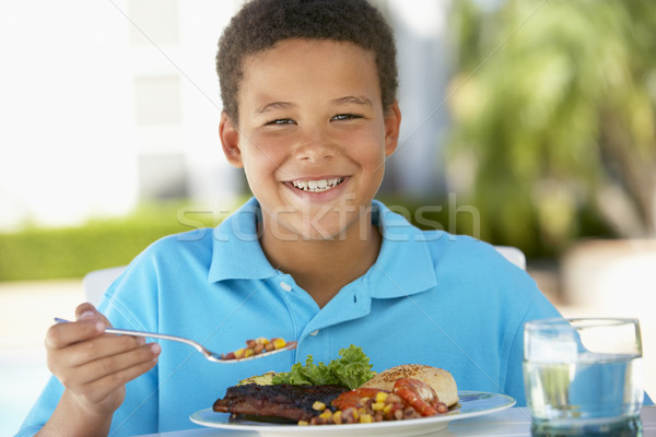 Młody chłopak jadalnia fresk ogród pić chłopca Zdjęcia stock © monkey_business