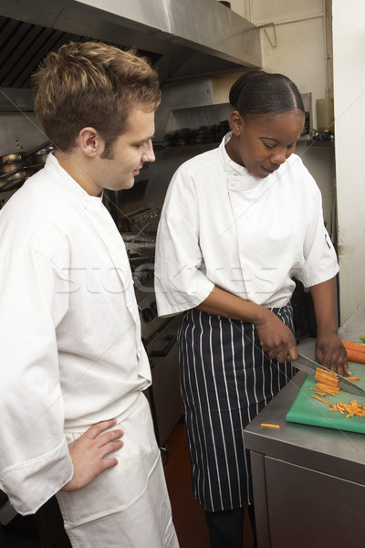 Chef Instructing Trainee In Restaurant Kitchen Stock photo © monkey_business