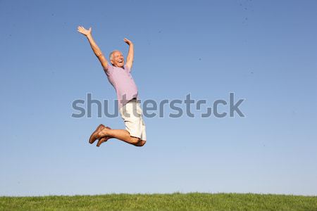 Young woman  jumping in air Stock photo © monkey_business